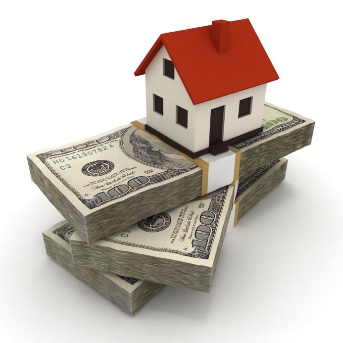 image depicting property taxes with little house with red roof sitting atop bundled $100 bills